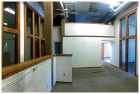 Before: general view of opaque office and corridor areas before construction
